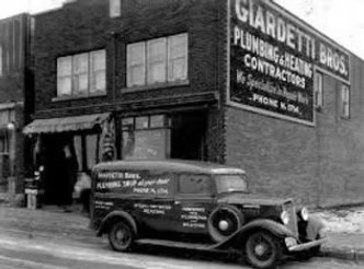 Historic black-and-white photograph of the original commercial building associated with Big Ed's Pawn history