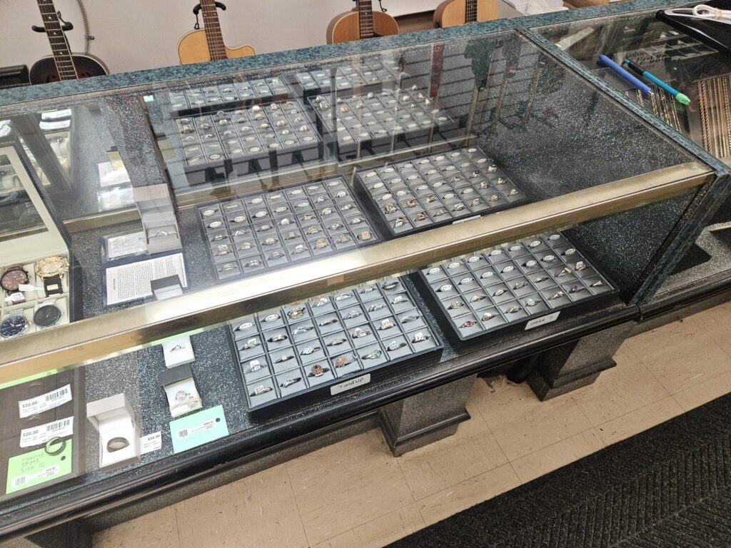 Sell gold and jewellery at Big Ed's Pawn in Thunder Bay - ring display case